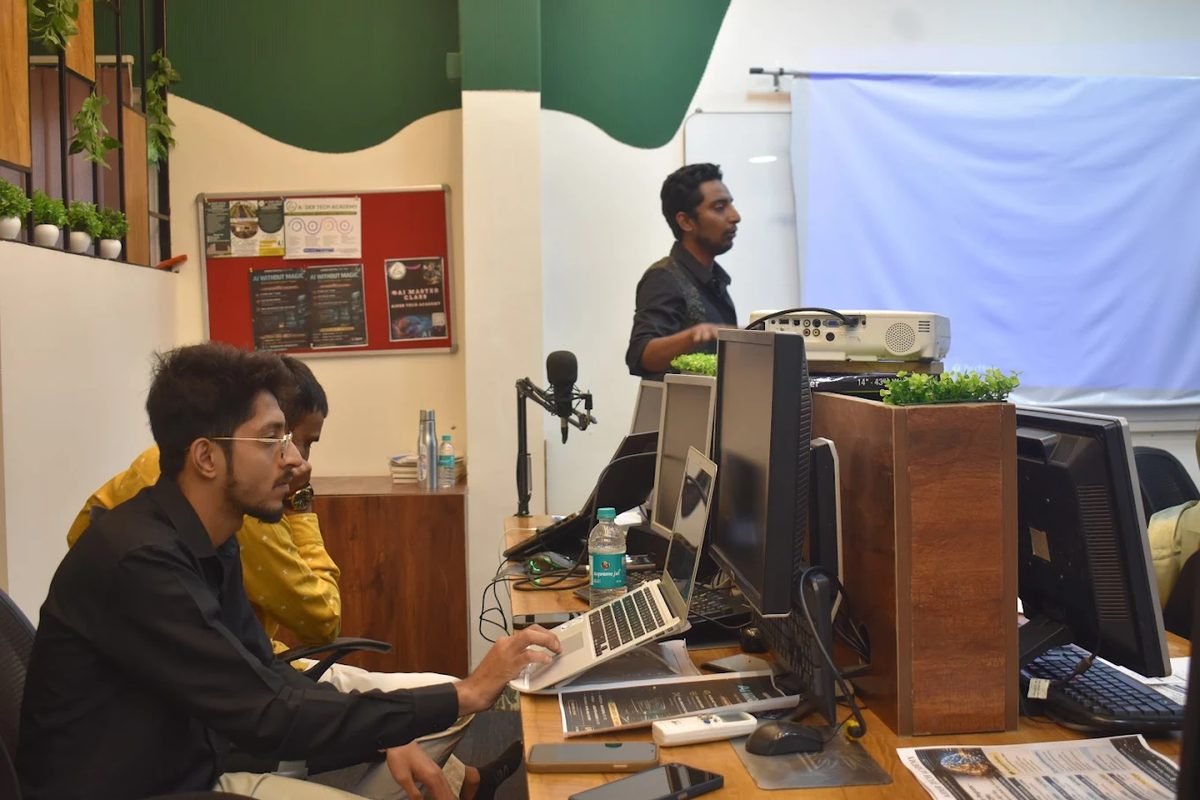 Engineers at workstations in the Digital Mega Factory studio