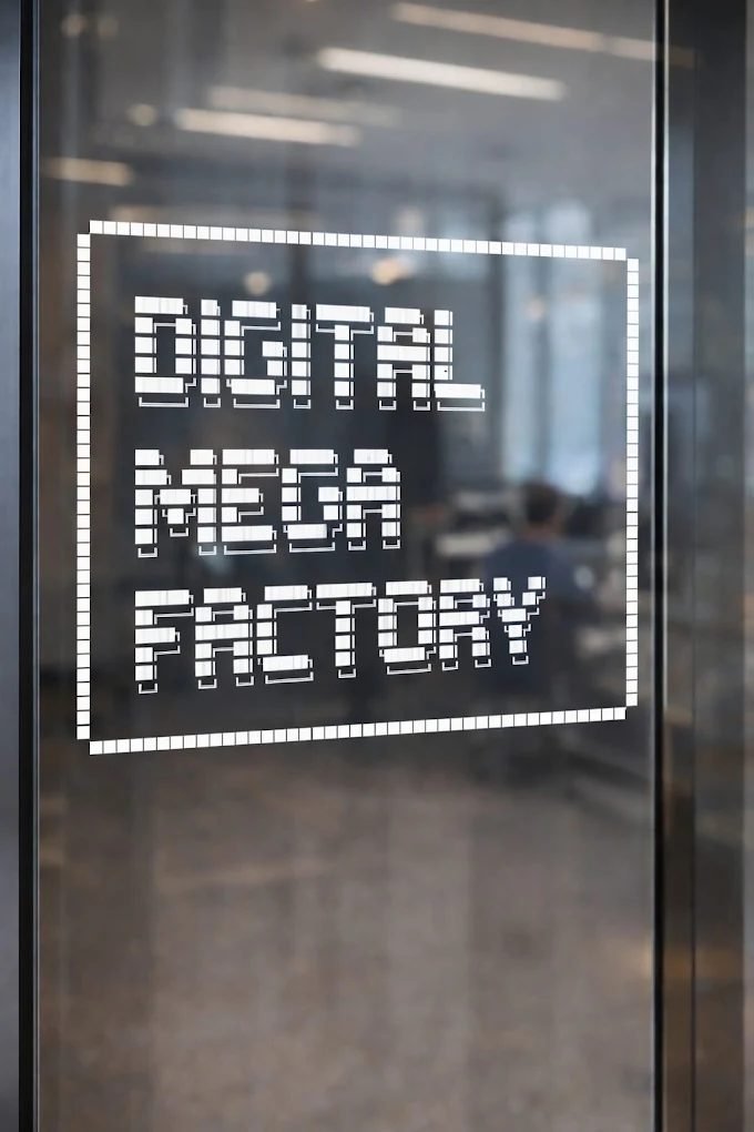 The Digital Mega Factory sign on the studio door