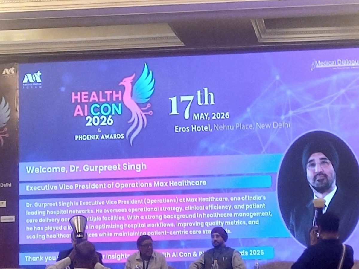 A speaker introduction on screen at Health AI CON 2026
