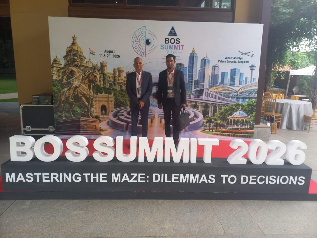 Delegates in front of the BOS Summit 2026 backdrop