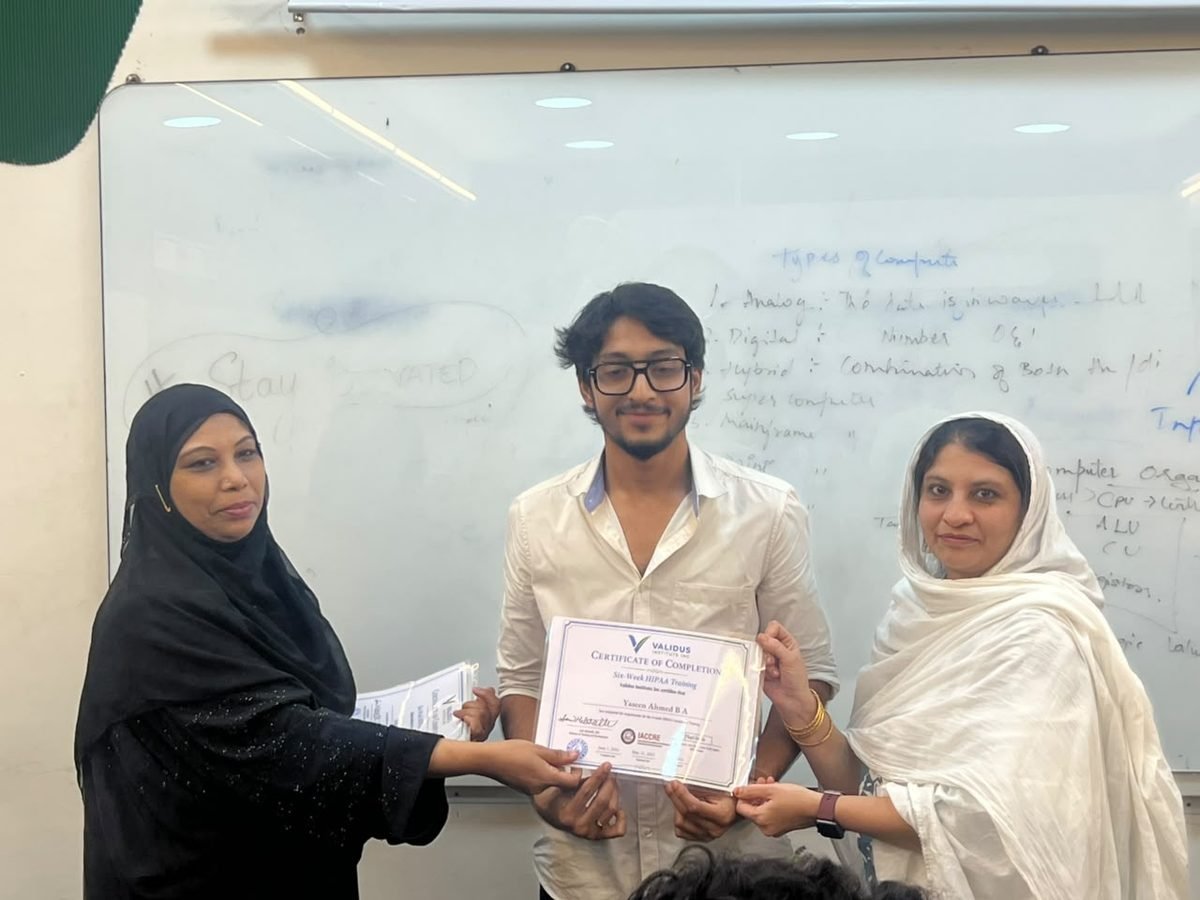 A participant receiving a certificate of completion at the HIPAA training