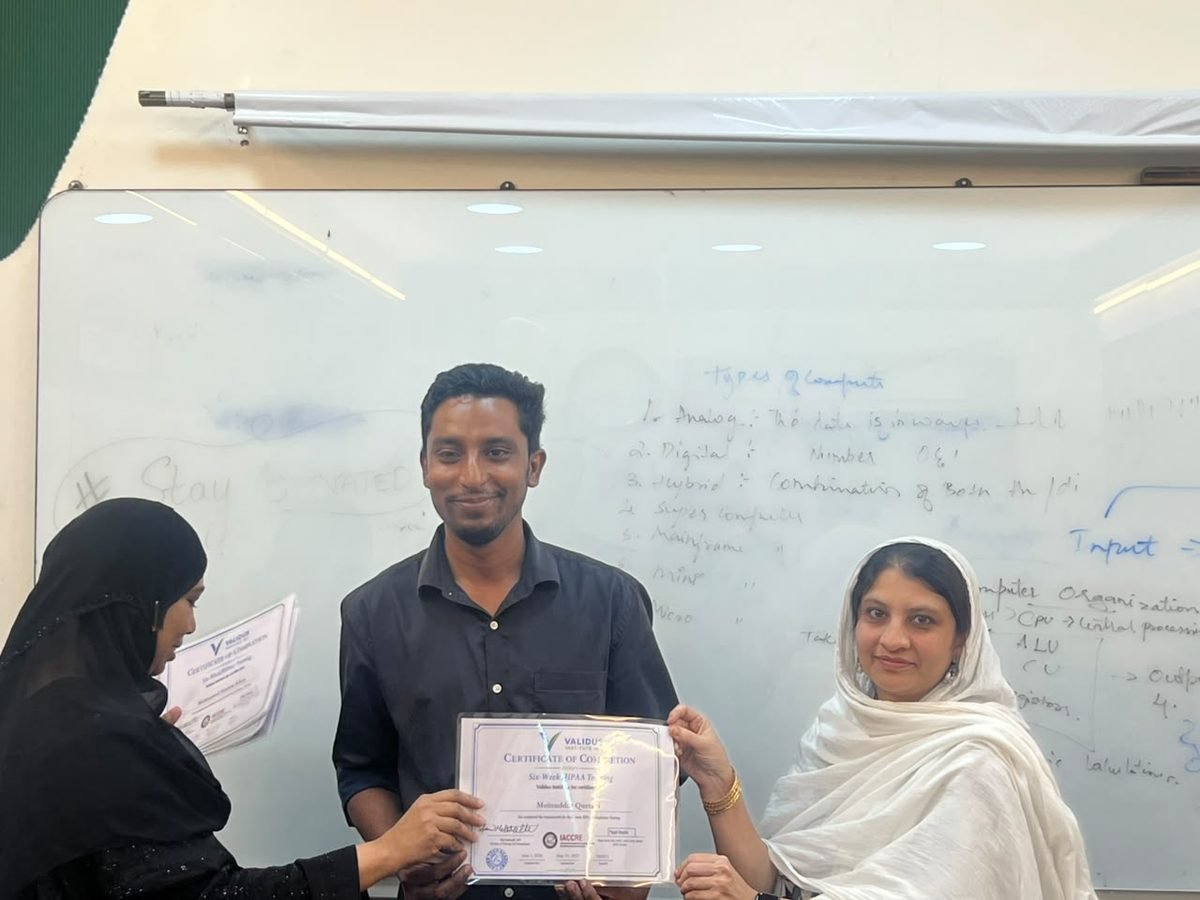 A participant receiving a certificate of completion at the HIPAA training