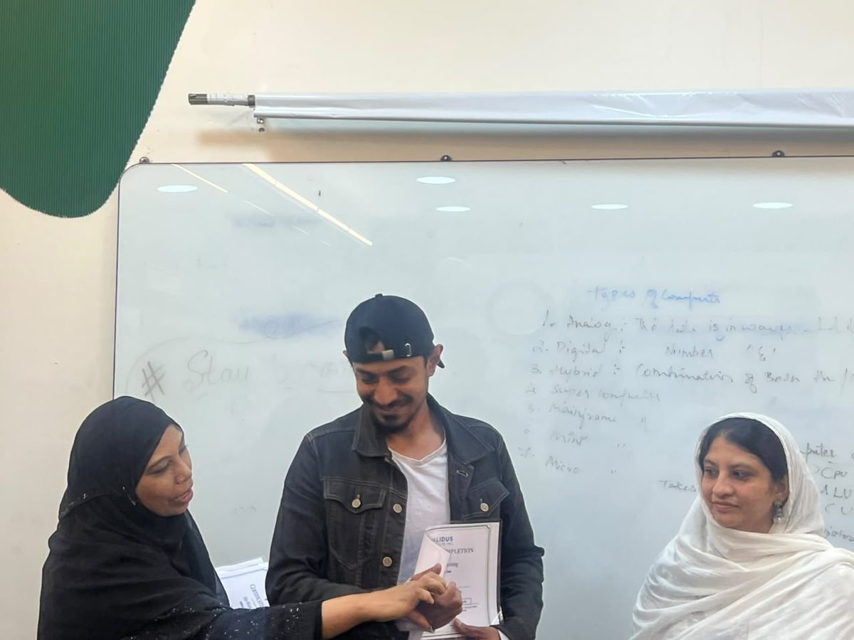 A participant receiving a certificate of completion at the HIPAA training