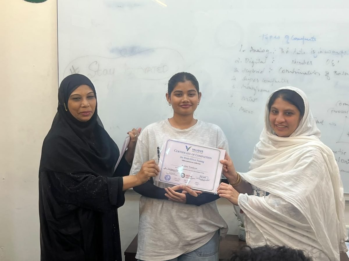 A participant receiving a certificate of completion at the HIPAA training