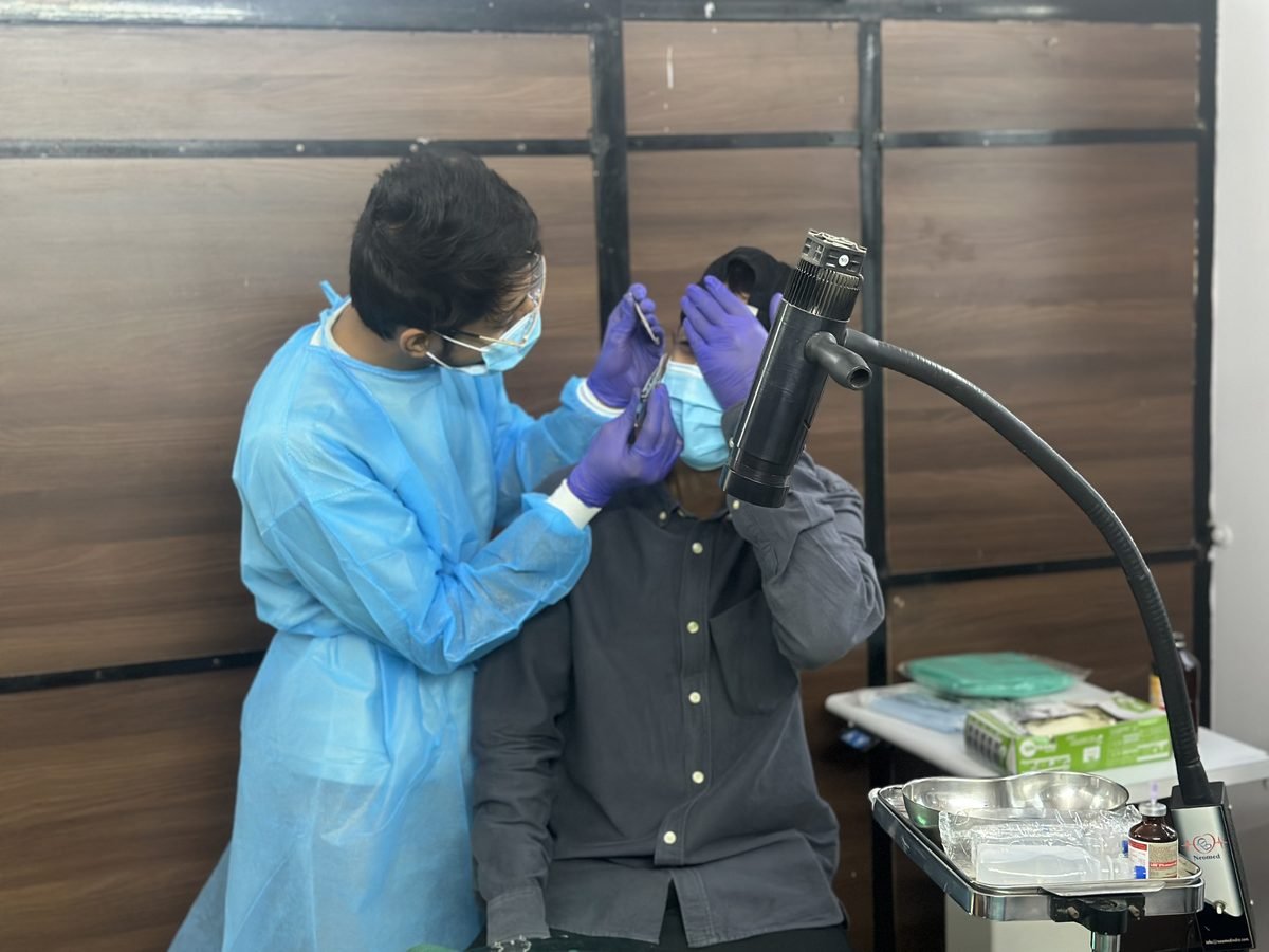 Ocularist and patient during examination